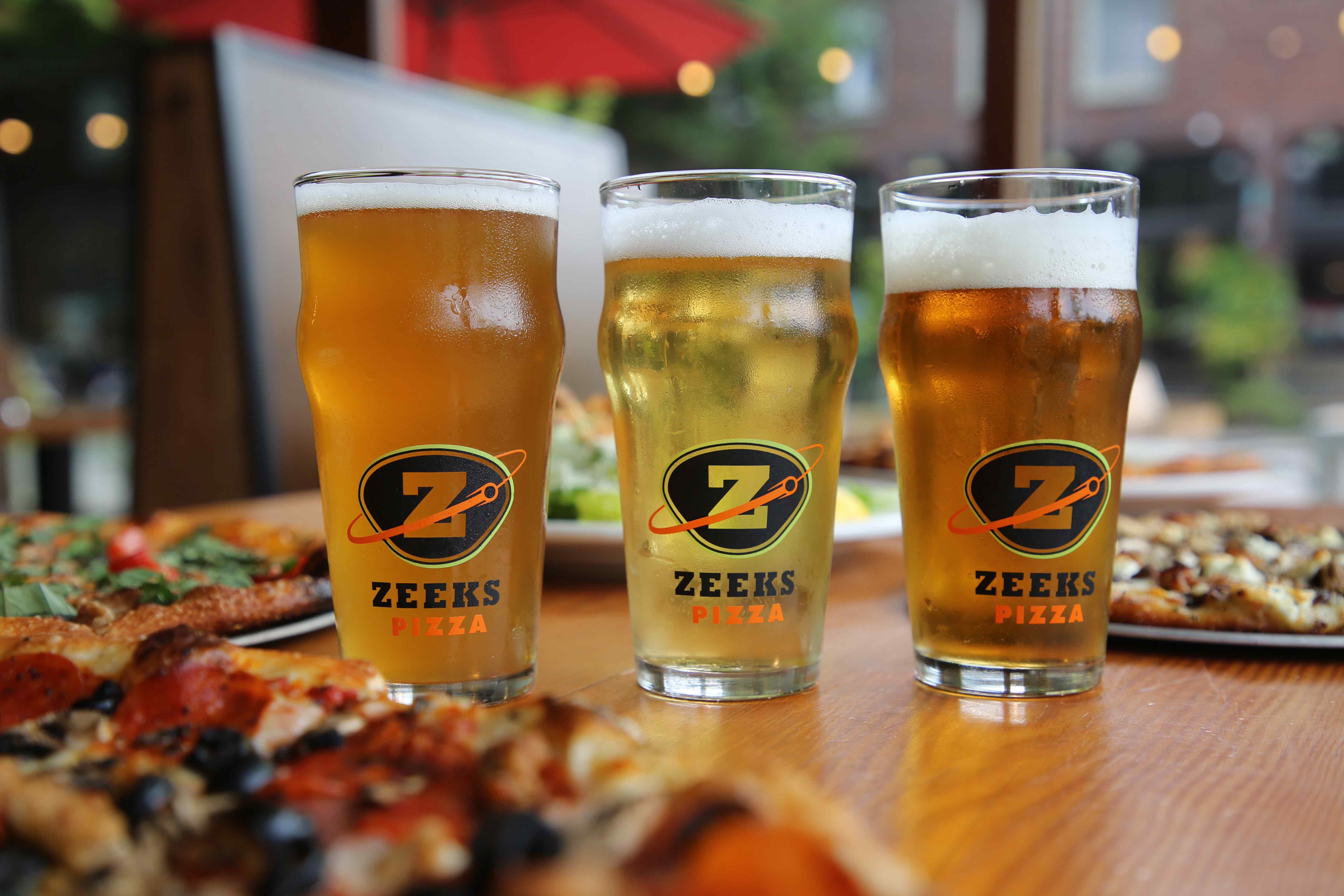 The pairing of pizza and beer is one of the benefits of visiting a Zeeks Pizza location (image courtesy of Zeeks Pizza)