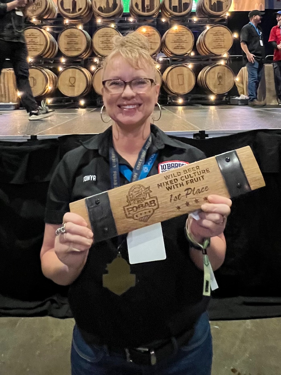 Tonya Cornett of 10 Barrel Brewing receiving her first of three awards at the 2023 Festival of Wood and Barrel Aged Beer.