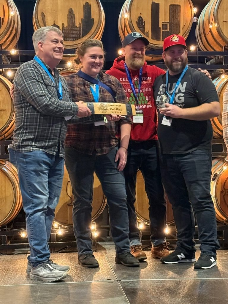 Sun King Brewery receiving one of its two awards at the 2024 Festival of Wood & Barrel Aged Beer.